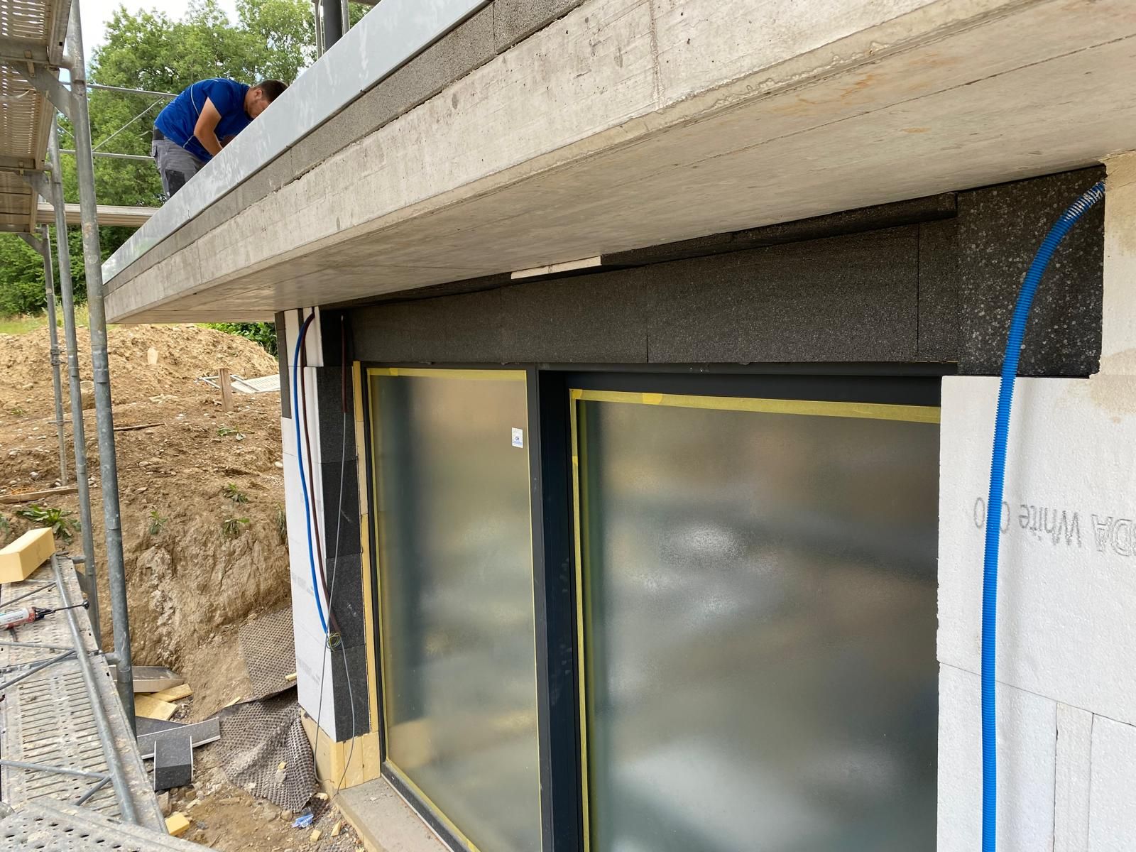 Isolation de facade par BNG Renovation : pose d'isolant peripherique et crepi de finition